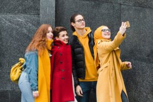 group-happy-teenagers-taking-selfie-together_23-2148421592